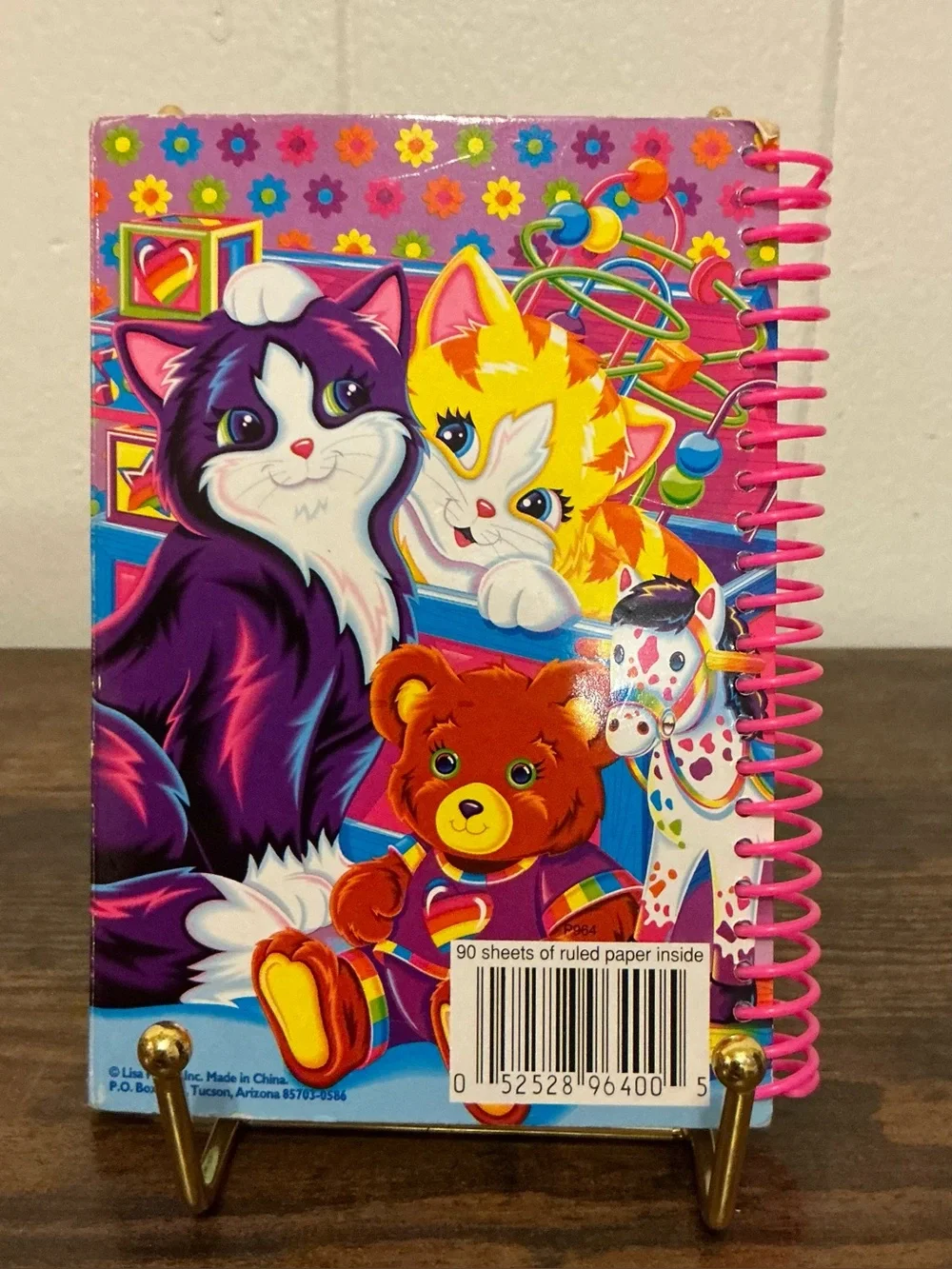 A vintage 1990s Lisa Frank snap mini notebook features colorful Playtime Kittens